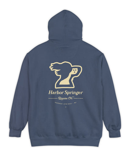 Blue color hoodie by the Harbor Springer brand with a springer spaniel dog logo and Brease On tagline on the back.
