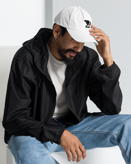 Man wearing white dad hat with brand logo by the Harbor Springer brand.