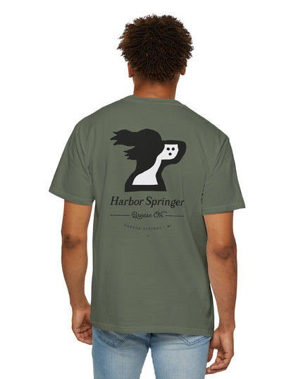 Man wearing a green color tee by the Harbor Springer brand with a springer spaniel dog logo and Brease On tagline on the back.