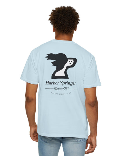 Man wearing light blue t-shirt by the Harbor Springer brand with a springer spaniel dog logo and Brease On tagline on the back.