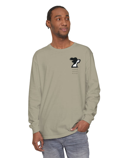 Man wearing a tan color long sleeve t-shirt by the Harbor Springer brand with a springer spaniel dog logo and Harbor Springs Michigan text.