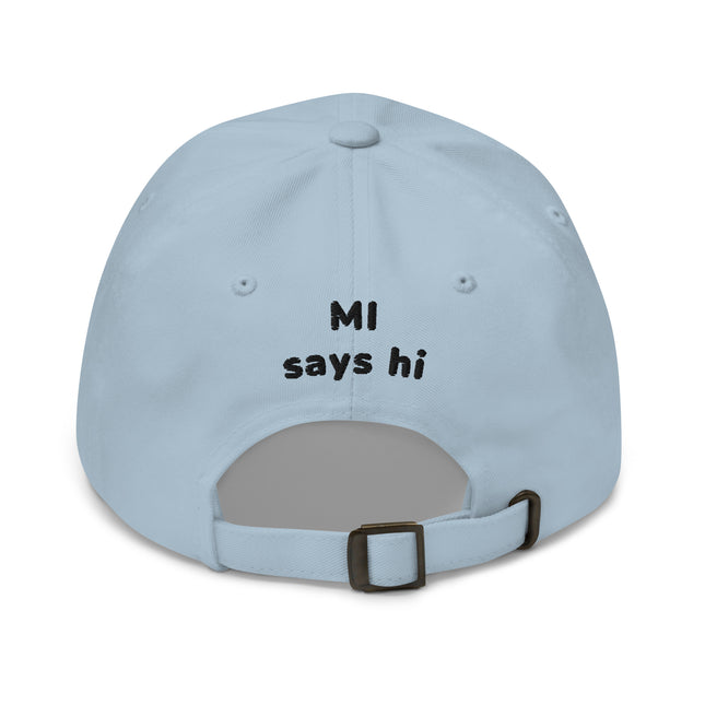 Back of a light blue hat with adjustable strap with Michigan brand MI Says Hi title embroidered.
