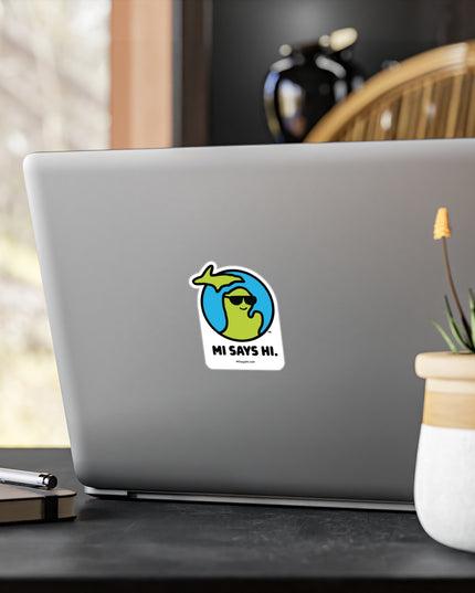 Waving Michigan logo wearing sunglasses on a vinyl sticker applied to a laptop.