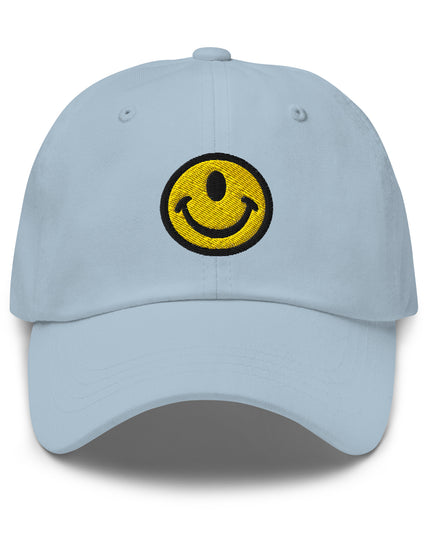 Light Blue dad hat with the Smileclops™ brand logo of a one-eyed smile face, the official logo of resilient positivity for those who remain, in all things, Oddly Happy™.