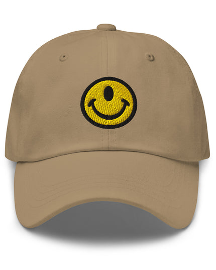Khaki baseball hat with the Smileclops™ brand logo of a one-eyed smile face, the official logo of resilient positivity for those who remain, in all things, Oddly Happy™.
