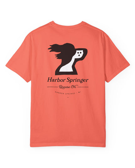 Salmon color t-shirt by the Harbor Springer brand with a springer spaniel dog logo and Brease On tagline on the back.