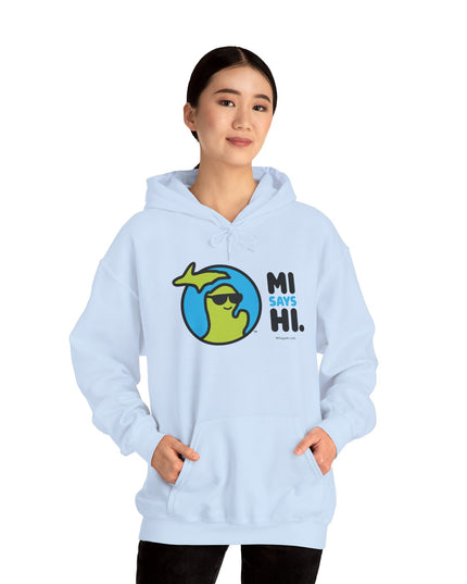 Woman wearing a light blue hoodie with waving Michigan logo wearing sunglasses and smiling for the MI Says Hi brand.